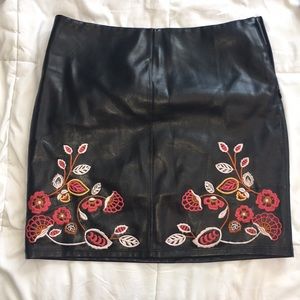 Faux leather skirt with floral detail